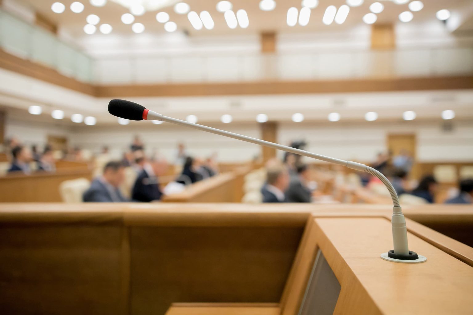 Session of Government. Conference room or seminar meeting room in business event. Academic classroom training course in lecture hall. blurred businessmen talking. modern bright office indoor